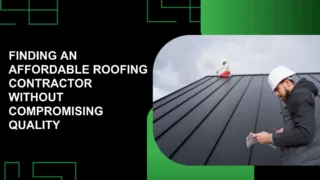 Construction worker in a yellow helmet and safety vest using a power drill to install metal roofing panels on a house under clear blue skies.